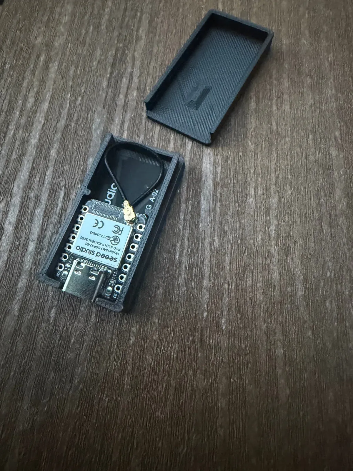 ESP32-S3 CSI sensing node inside a 3D-printed case with external WiFi antenna