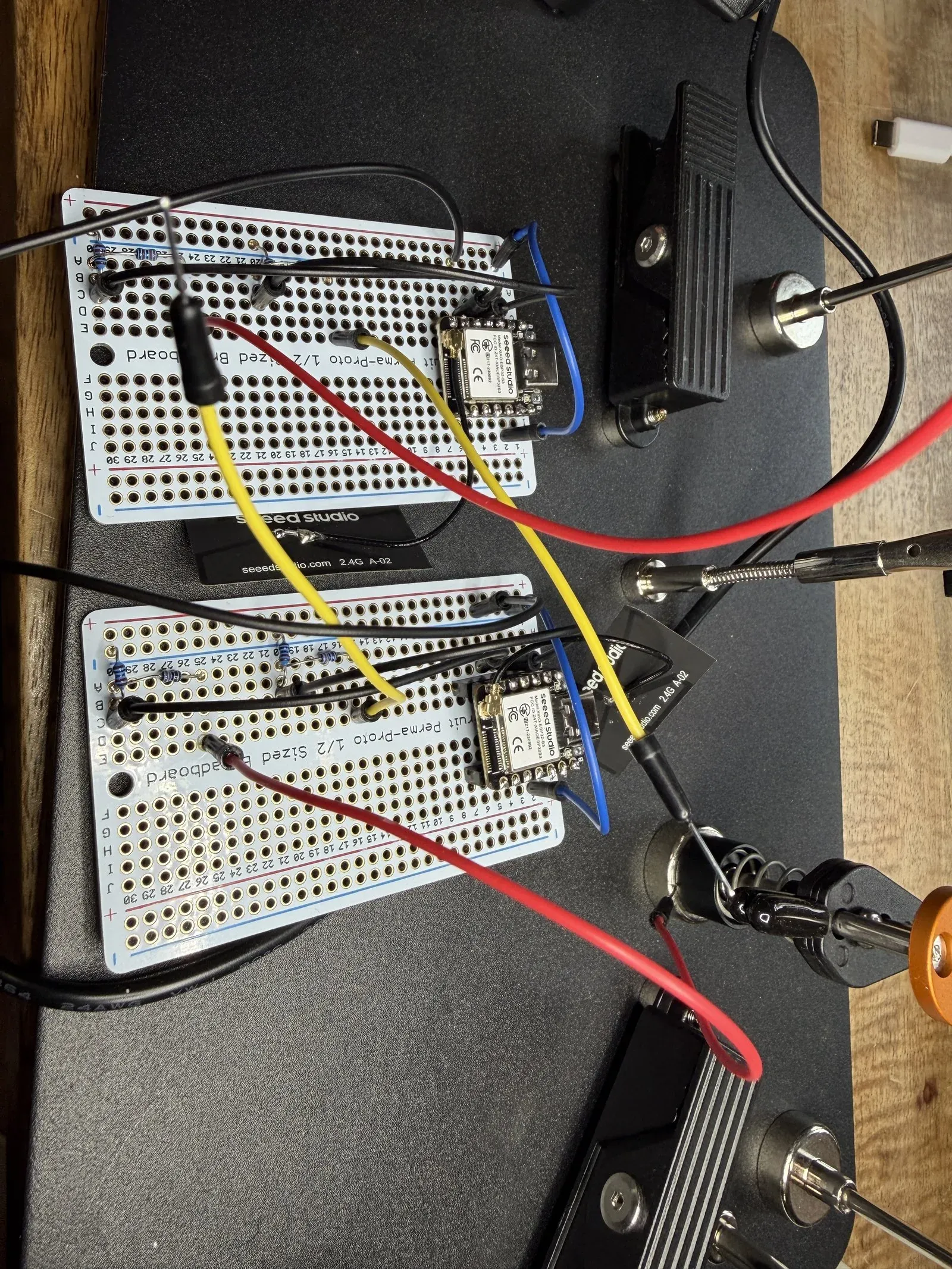 Two XIAO ESP32-S3 boards on breadboards during bring-up