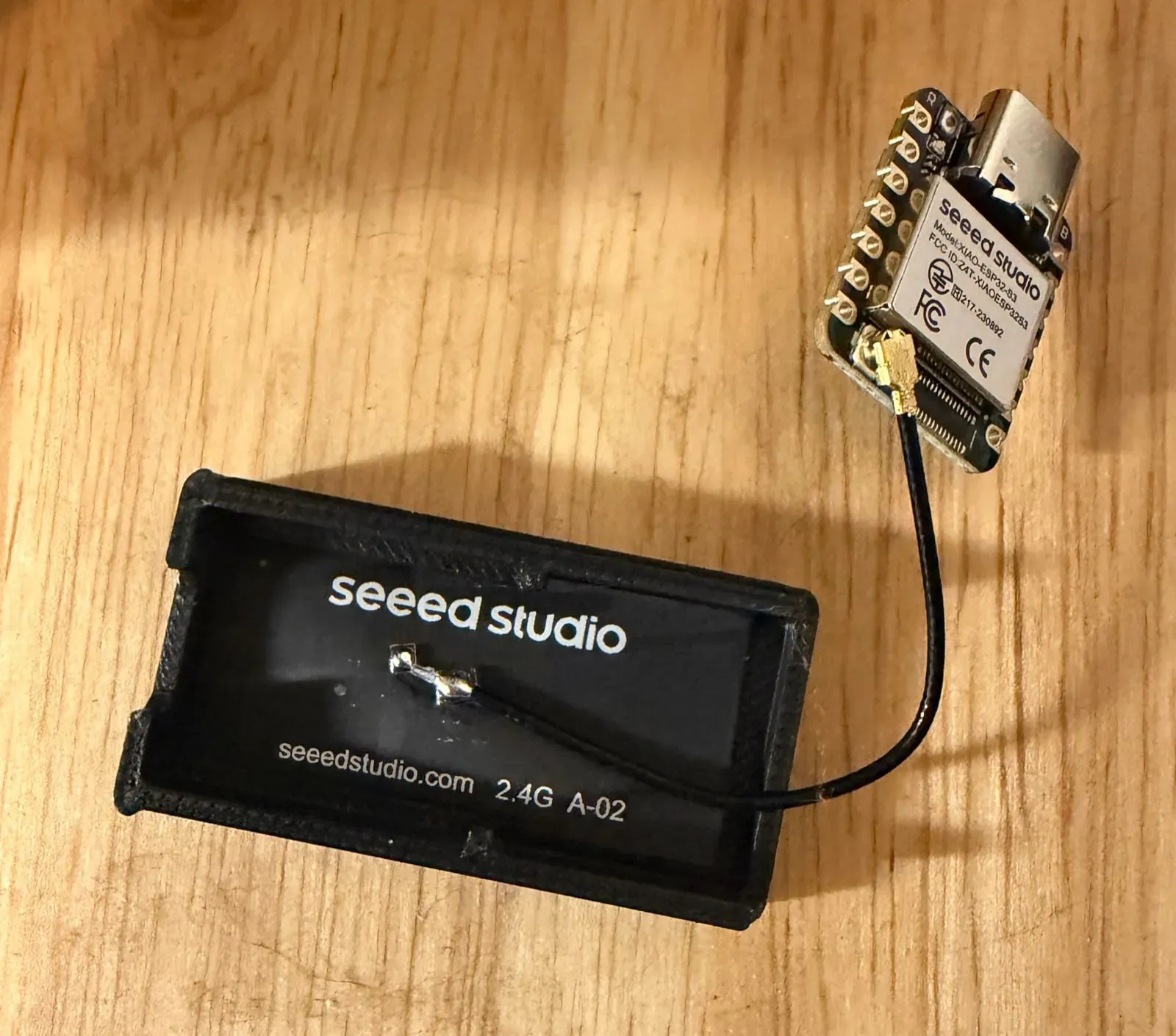 Seeed XIAO ESP32-S3 WiFi CSI sensor node with external 2.4GHz antenna and 3D-printed enclosure